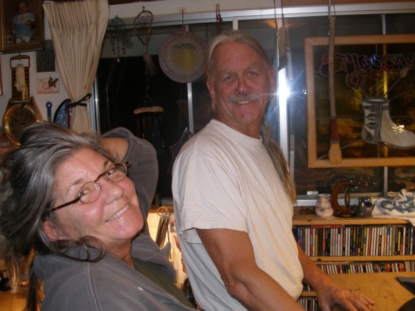 penny and dave in their shop at home
